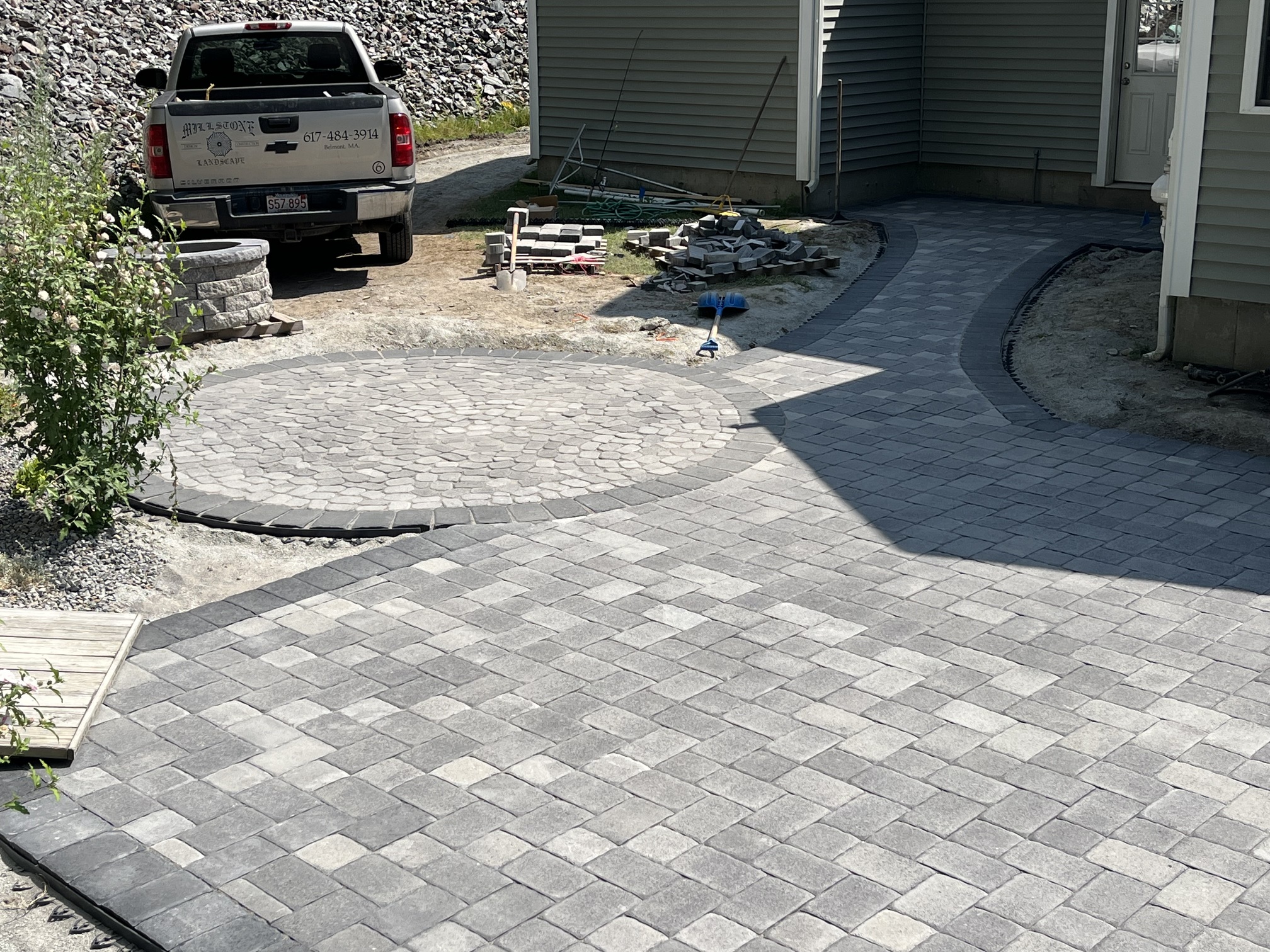 stone walkway, patio, and firepit