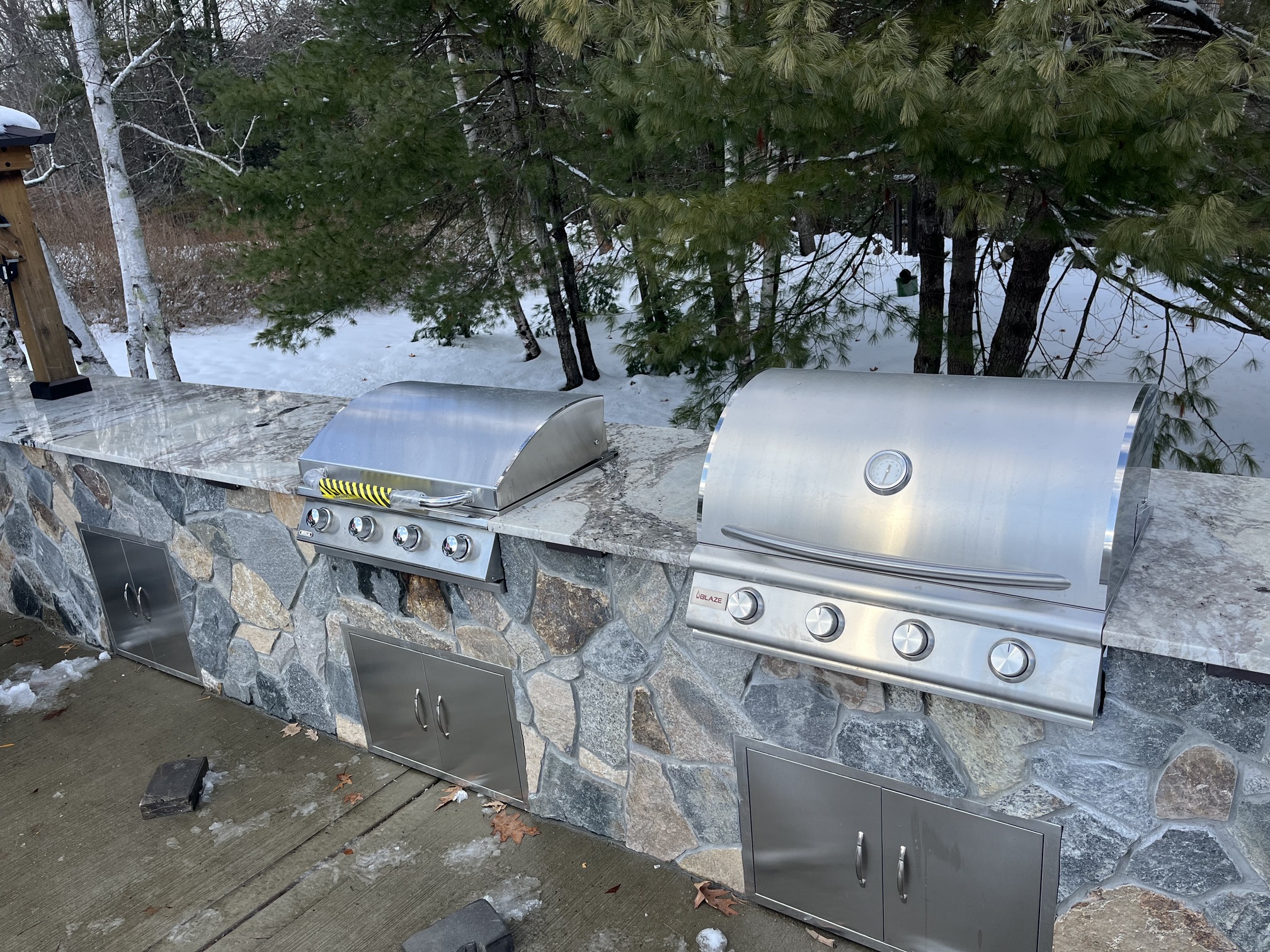 stone and marble outdoor kitchen and grilling stations