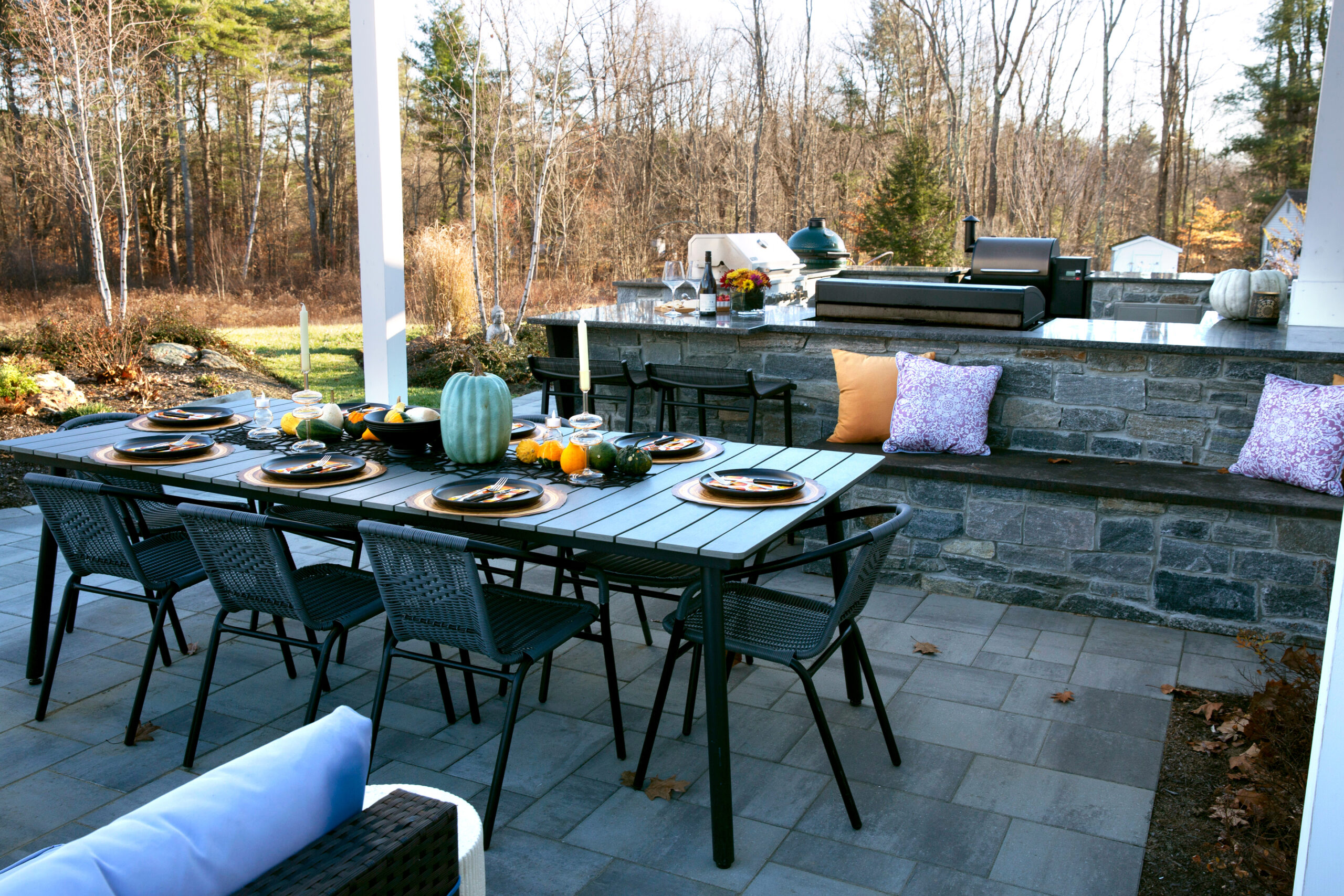 outdoor kitchen and dining area patio with stonework